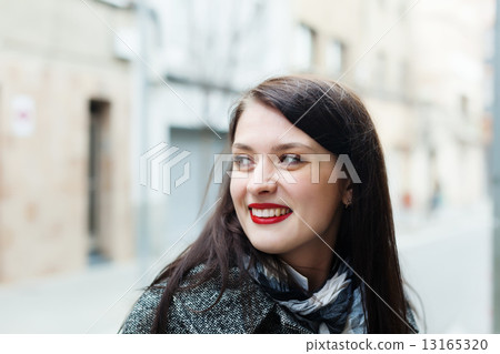 long-haired woman in autumn 13165320
