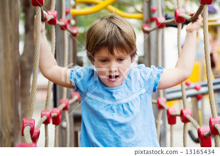 Excited girl developing dexterity 13165434