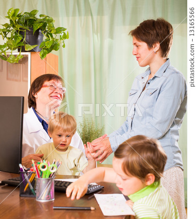 Doctor examining children Doctor examining children 13165566