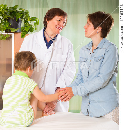 Doctor examining child Doctor examining child 13165568