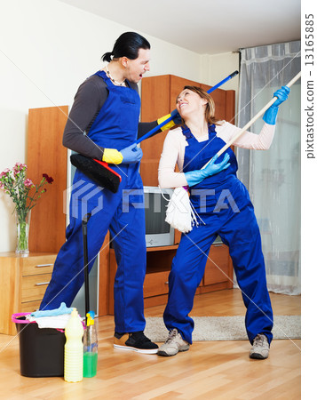 Playful cleaning premises team in uniform Playful cleaning premises team in uniform 13165885