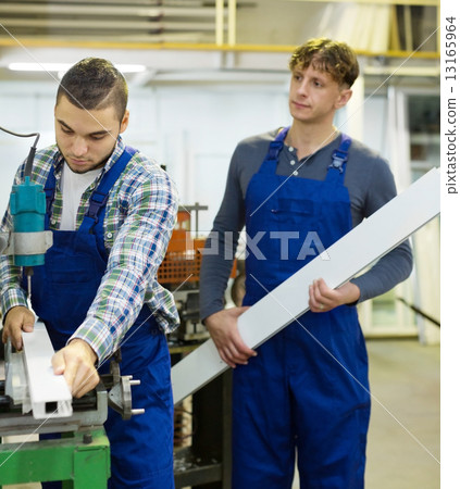 Couple of workmen at factory 13165964