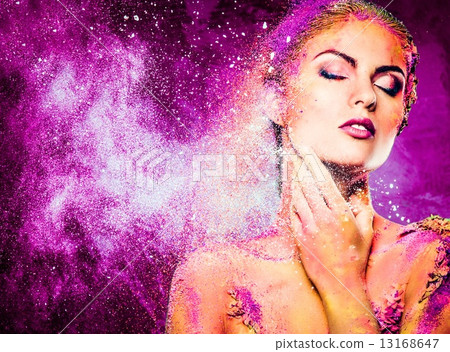 Beautiful young woman with conceptual colourful body art 13168647