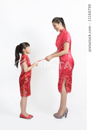 Young chinese mother in cheongsam giving red packet to daughter isolated white background 13168799
