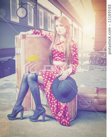 The girl at the retro railway station The girl at the retro railway station 13169588