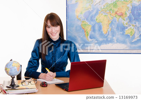 Specialist travel agency writes in a notebook 13169973