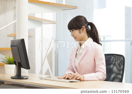 A woman working in a bright office 13170569