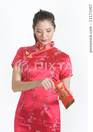 One young chinese woman in cheongsam checking her red packet amount in isolated white background 13171007