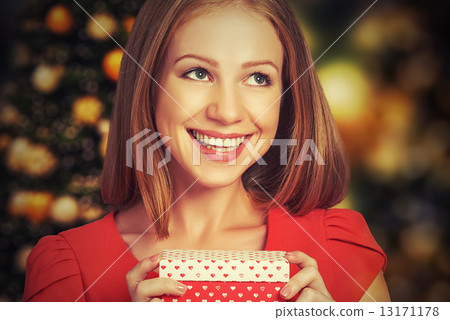 beauty girl in red dress with gift box to Christmas or Valentine's Day beauty girl in red dress with gift box to Christmas or Valentine's Day 13171178