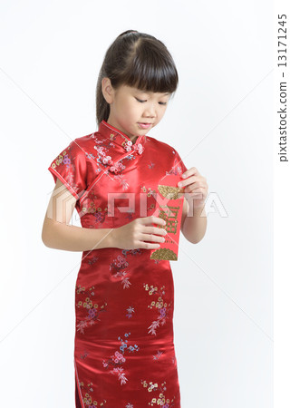 1 young chinese girl in cheongsam opening her lunar new year red packet isolated white background 13171245