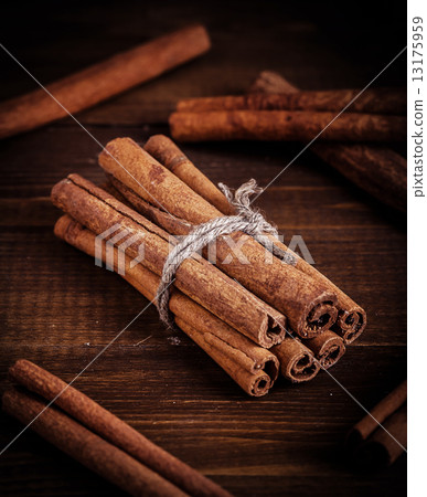Cinnamon on the wooden background. Cinnamon on the wooden background. 13175959