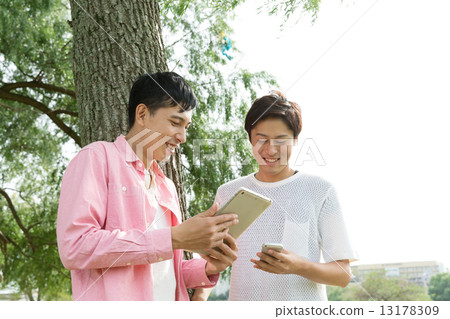 Young people with tablets and mobile phones Young people with tablets and mobile phones 13178309