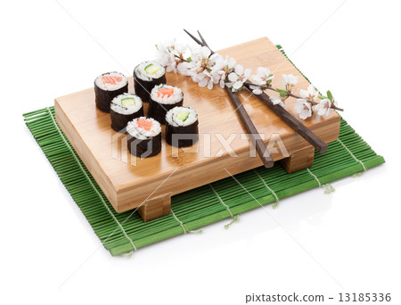 Sushi maki set with salmon and cucumber and sakura branch Sushi maki set with salmon and cucumber and sakura branch 13185336