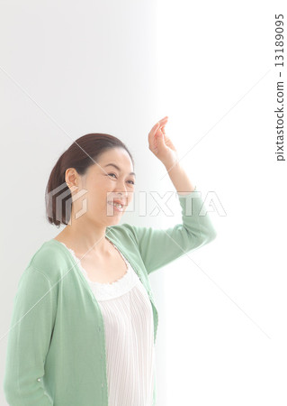 Middle aged women taking sunlight 13189095