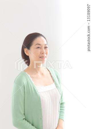 Middle aged women taking sunlight 13189097