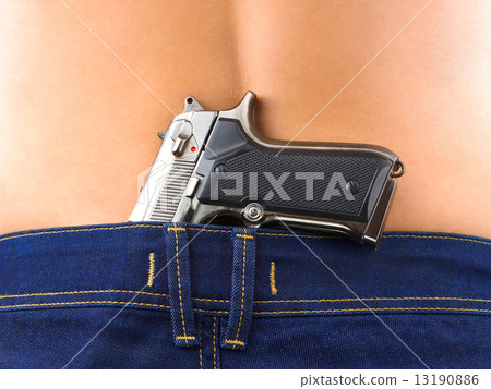 Woman in jeans and gun Woman in jeans and gun 13190886