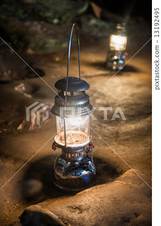 The old antique storm lantern in a cave The old antique storm lantern in a cave 13192495