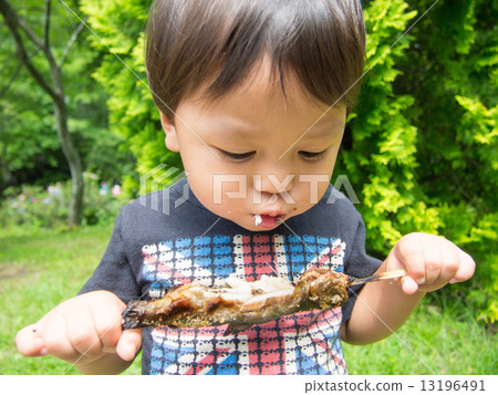 Boys are eating rainbow trout 13196491