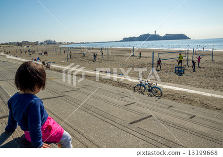 Watching beach volleyball 13199668