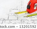 Tape measure and pencil over a construction plan drawing 13201592