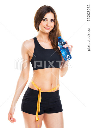 Woman measuring perfect shape of beautiful thigh with bottle of 13202981