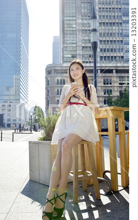 A woman in an open cafe 13203391