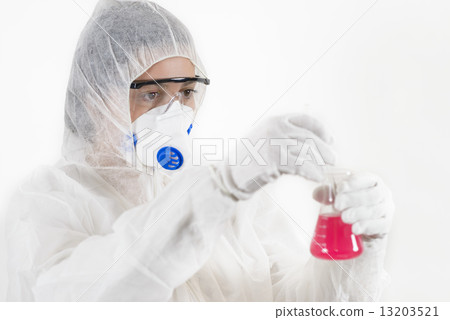 Young Woman wearing protective suit holding some laboratory glassware Young Woman wearing protective suit holding some laboratory glassware 13203521