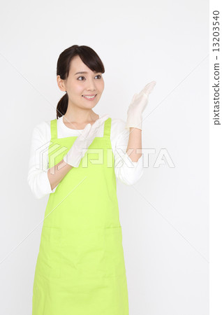 A woman with an apron A woman with an apron 13203540