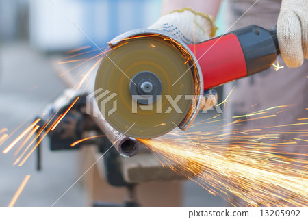 Sparks flying metal cutting abrasive disk. Sparks flying metal cutting abrasive disk. 13205992