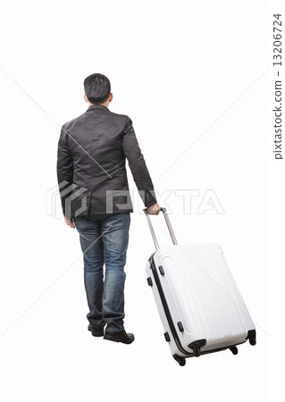 rear view of young man and pulling belonging luggage walking to 13206724