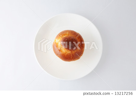 Brioche bread on a dish French bread White background Brioche bread on a dish French bread White background 13217256