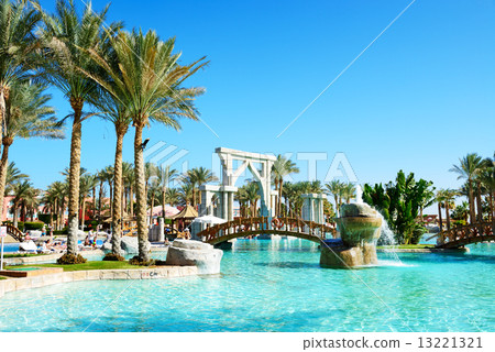 The swimming pool near outdoor restaurant at luxury hotel, Sharm The swimming pool near outdoor restaurant at luxury hotel, Sharm 13221321