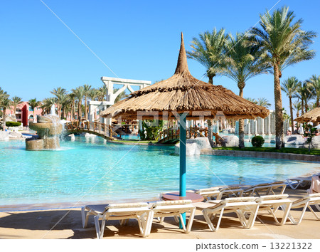 Sunbeds near swimming pool at luxury hotel, Sharm el Sheikh, Egy Sunbeds near swimming pool at luxury hotel, Sharm el Sheikh, Egy 13221322