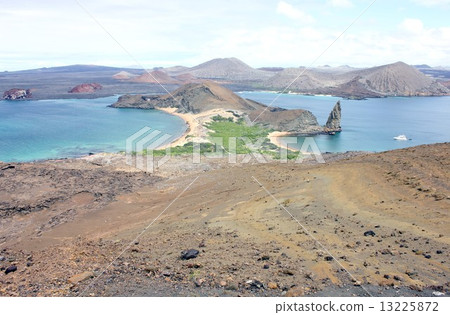 Island of biological evolutionary theory floating on the Pacific Ocean of South America Ecuador, beautiful sea view of Bartolomee Island overlooking Santiago Island in the Galapagos Islands and a cove with tourist boats visiting tourists 13225872