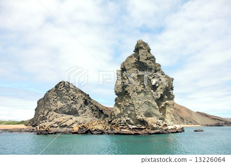 Island of biological evolution theory floating on the Pacific Ocean of South America Ecuador, Pinnacle of Bartolome Island floating off Santiago Island in the Galapagos Islands and a beautiful sea landscape 13226064
