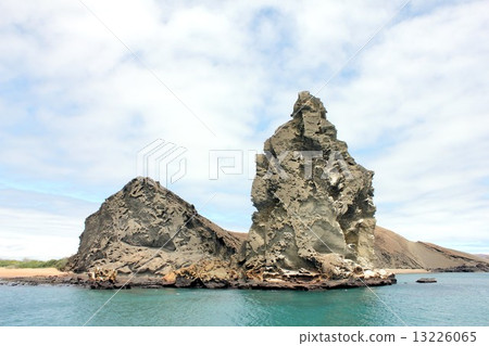 Island of biological evolution theory floating on the Pacific Ocean of South America Ecuador, Pinnacle of Bartolome Island floating off Santiago Island in the Galapagos Islands and a beautiful sea landscape 13226065