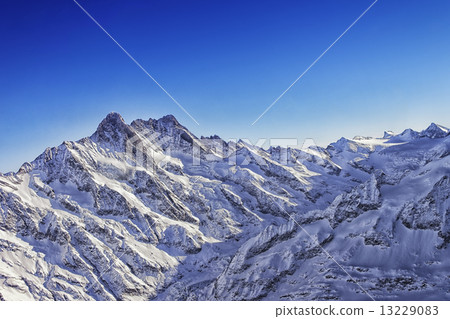 Jungfrau mountain ridge helicopter view in winter Jungfrau mountain ridge helicopter view in winter 13229083