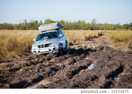 Car stucked in deep mud 13233075