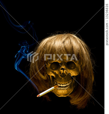 Human skull in wig smoking cigarette 13236816