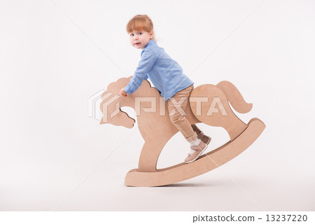 Child with the toy horse Child with the toy horse 13237220