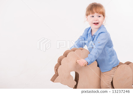 Child with the toy horse 13237246