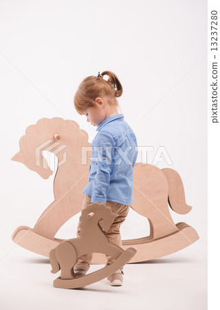 Child with the toy horse Child with the toy horse 13237280