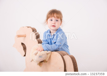 Child with the toy horse 13237359