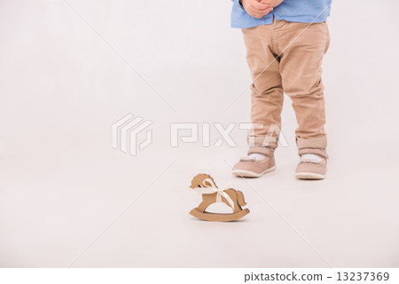 Child with the toy horse 13237369
