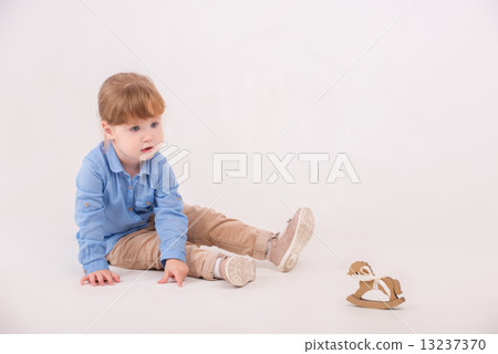 Child with the toy horse Child with the toy horse 13237370