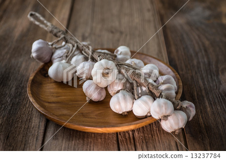 Bunch of dried garlic bulbs on a wooden table 13237784