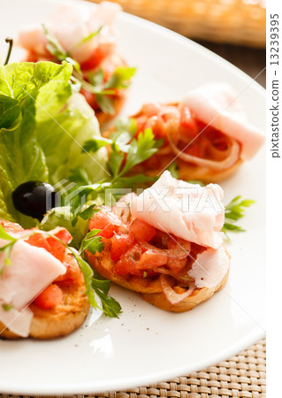 Bruschetta with tomato and ham 13239395
