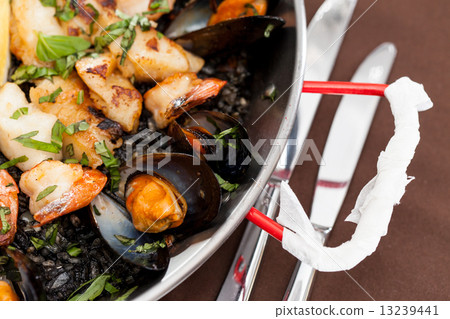 seafood paella in the fry pan 13239441