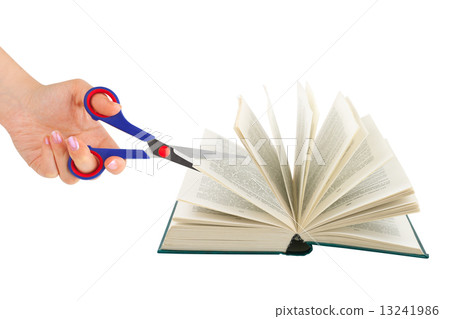Hand with scissors cutting book Hand with scissors cutting book 13241986