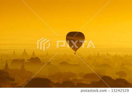Balloon over plain of Bagan in misty morning, Myanmar 13242529